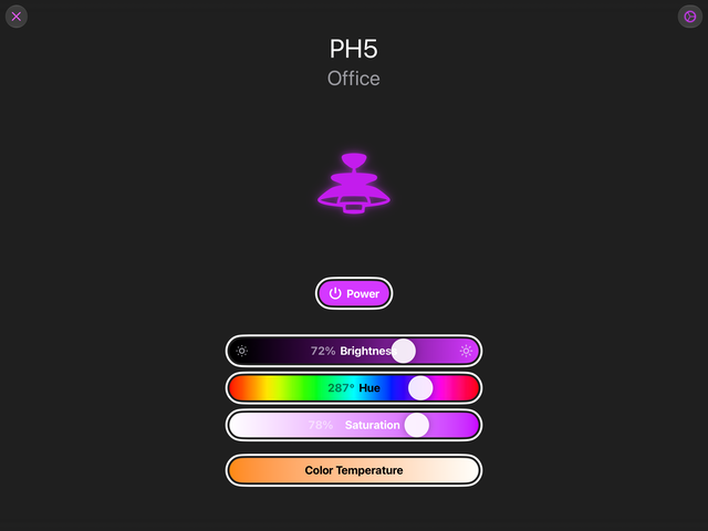 An iPad screenshot: a lamp drawn in magenta, a power button under it, and sliders for brightness, hue, saturation and colour temperature